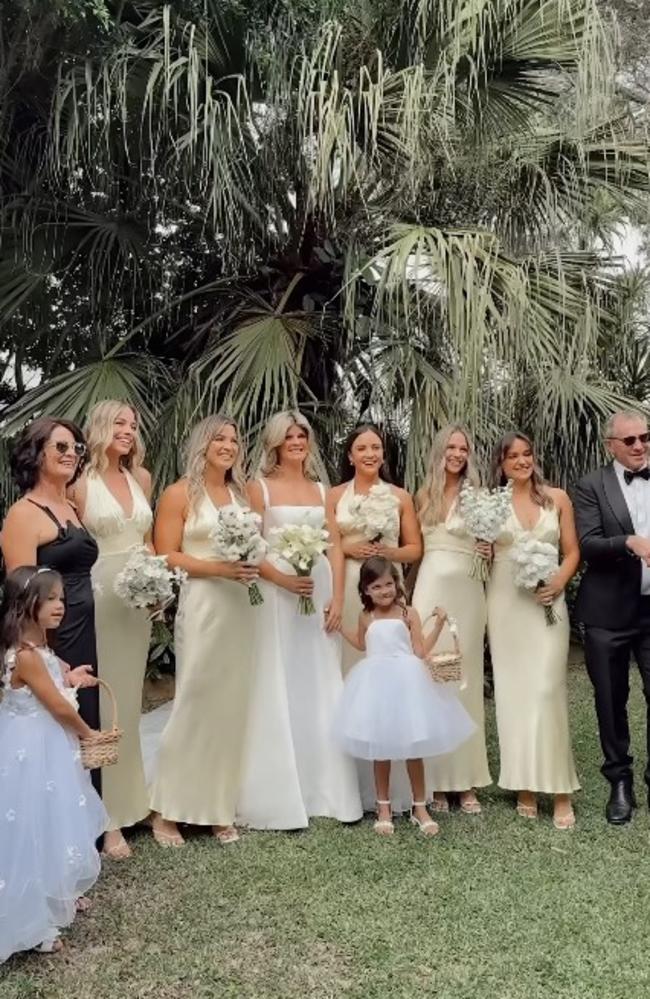 Margot Robbie (second from left) remained a respectful distance from the bride in group photos. Picture: Instagram