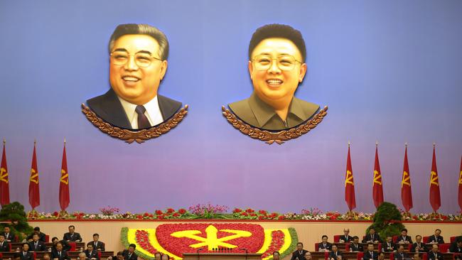 The portraits of late North Korean leaders Kim Il-sung, left, and Kim Jong-il hang inside the convention hall of the April 25 House of Culture. Picture: AP Photo/Wong Maye-E