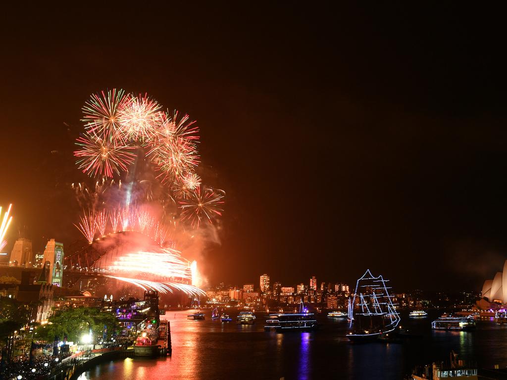 Fireworks explode to welcome in the New Year over the Sydney Harbour Bridge and the Sydney Opera House, as seen from Cahill Expressway during New Year's Eve celebrations in Sydney, Wednesday, January 1, 2020. (AAP Image for City of Sydney/Dean Lewins)