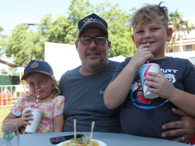 Five-year-old Molly Cowan, John Cowan and J.J. Cowan, 8, at the 2024 Darwin International Laksa Festival on Sunday, November 3. Picture: Zizi Averill