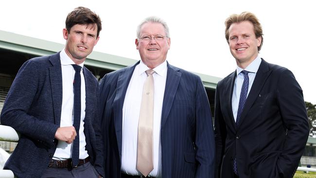 Trainer Anthony Cummings (centre) with his sons James (left), who trains for Godolphin, and Ed. Picture: Tim Hunter