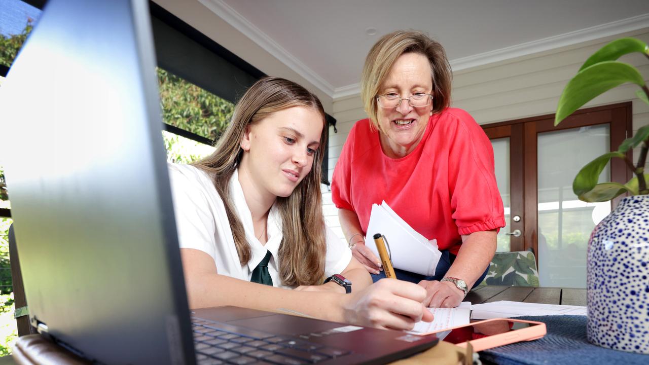 Amy Rofe, a Cavendish Road State High School student with mum Katrina Maguire. Photo: Steve Pohlner