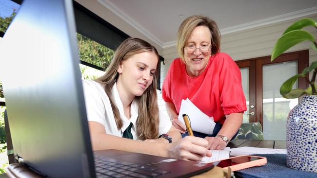 Amy Rofe, a Cavendish Road State High School student with mum Katrina Maguire. Photo: Steve Pohlner