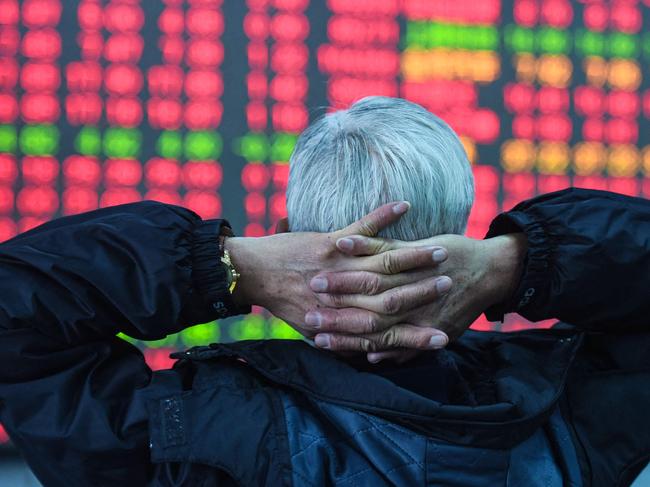 An investor looks at a screen showing stock market movements at a securities company in Hangzhou, in eastern China's Zhejiang province on February 8, 2024. (Photo by AFP) / China Out