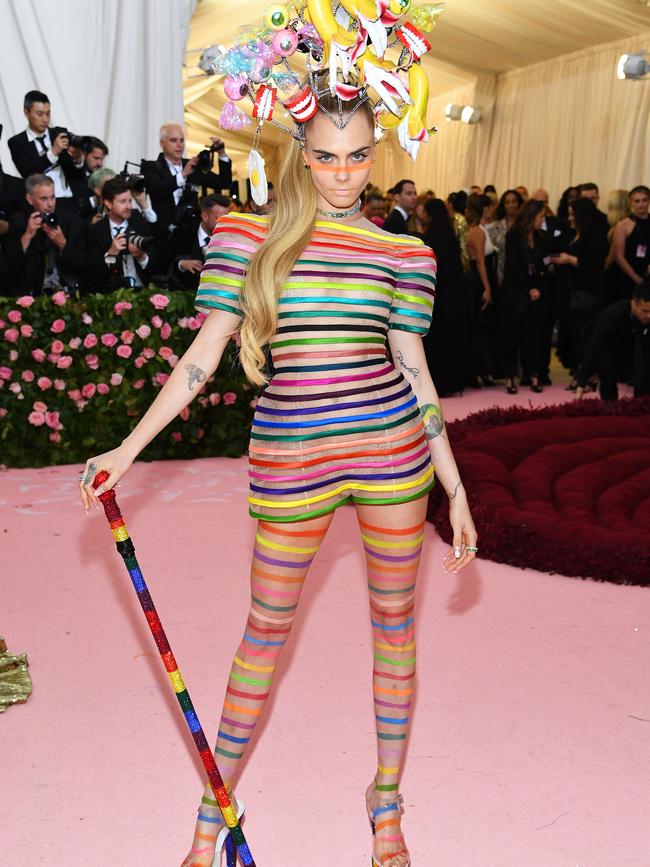 Cara Delevingne popped into Spotlight on the way to the Met Gala and asked one of the shop assistants to rap her in some of the sample ribbons. Picture: Getty.