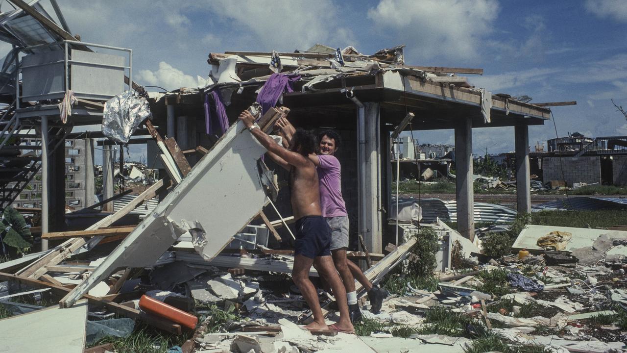 People sifting through rubble of homes after Cyclone Tracy. Supplied/MAGNT