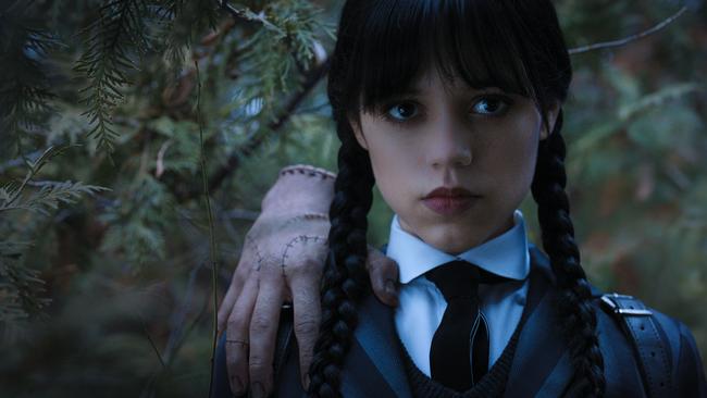 Ortega as Wednesday Addams in Wednesday, pictured with Thing.