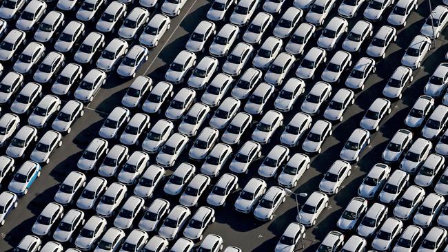 TOPSHOTS New Porsche cars are parked at the grounds of the Porsche plant in Leipzig, eastern Germany, on November 3, 2015. The US Environmental Protection Agency said late Monday, November 2, 2015, it had discovered that various six-cylinder 3.0 litre diesel VW Touareg, Porsche Cayenne and Audis were also rigged with a software which skews the results of pollution tests. AFP PHOTO / DPA / JAN WOITAS +++ GERMANY OUT +++