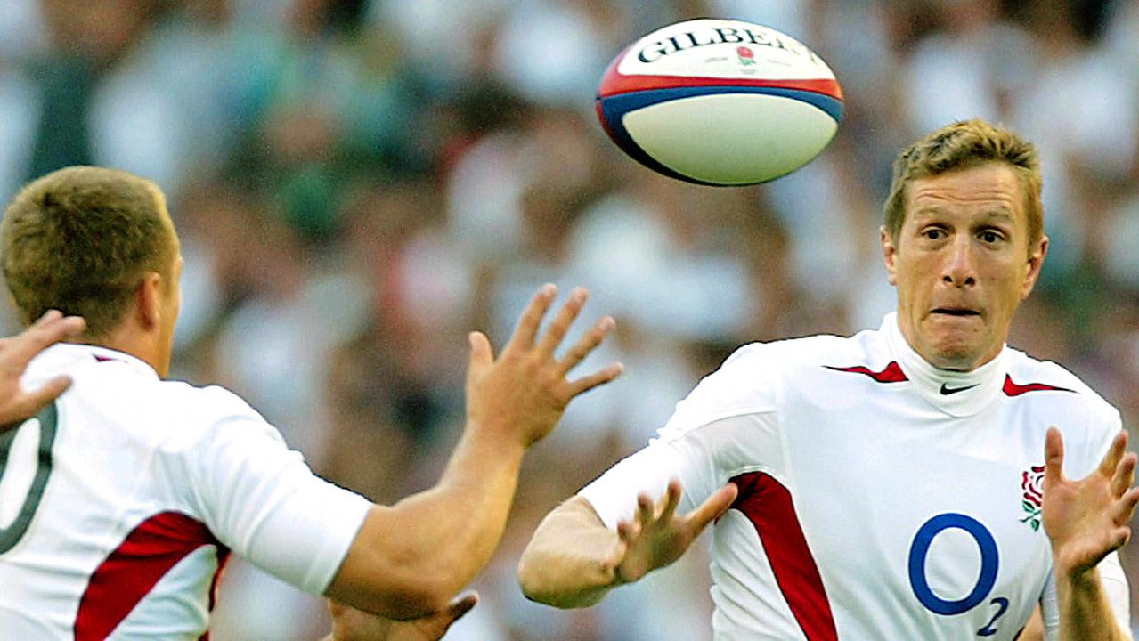 Jonny Wilkinson of England passes to Will Greenwood during a match against France.