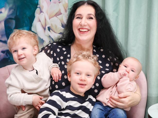 Rosie Giampaolo (53) with her three IVF babies Leonardo Giampaolo, 2, Luca Giampaolo, 3, and baby Leia. Picture: Brendan Beckett