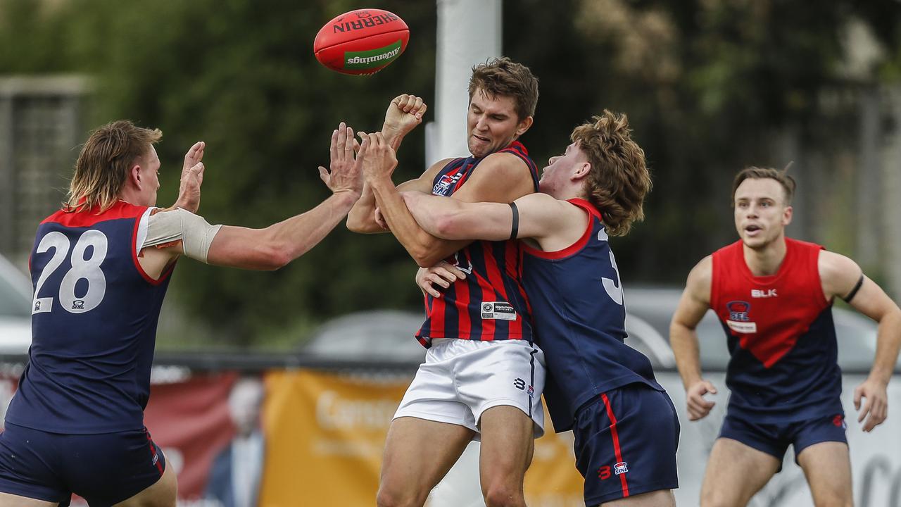 Southern: Jack Hastings handballs under pressure from all sides. Picture: Valeriu Campan