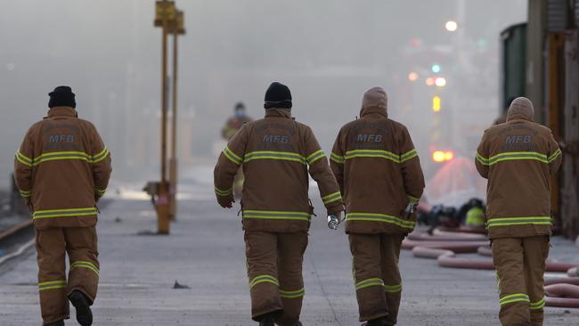 Firefighters continue to battle the fire, which is now under control. Picture: David Crosling