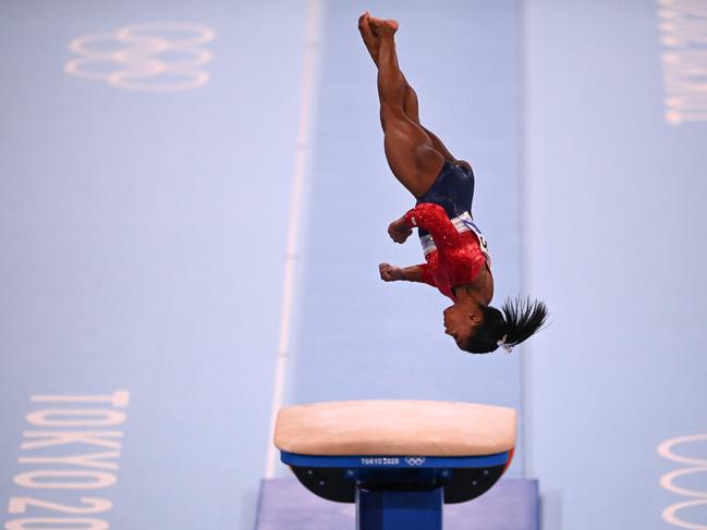 Simone Biles competes in the vault event of the artistic gymnastics women's team final. Picture: Martin Bureau/AFP