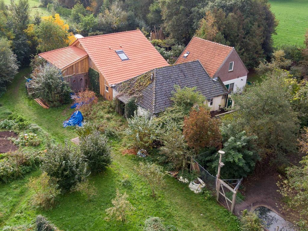 Police are using drones to get a full picture of the mysterious property where six family members were found locked in a basement. Picture: EPA/Wilbert Bijzitter