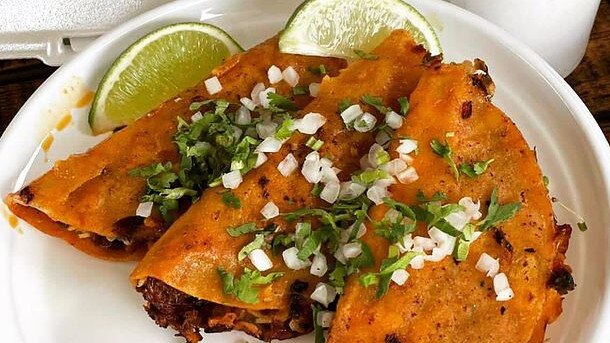 What makes birria queso tacos unique is how you eat them. The novelty of dipping the tacos into the broth and eating them in one bite. Picture: Chololo/Instagram