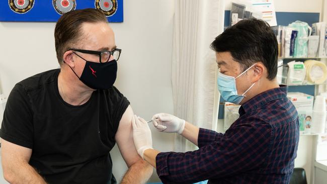 Qantas chief Alan Joyce receiving his Covid-19 AstraZeneca vaccination.