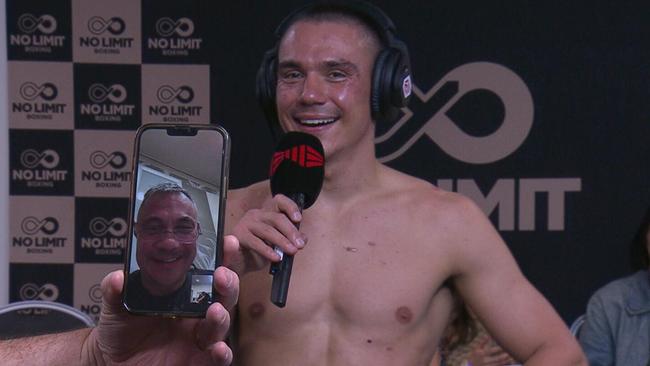 Kostya Tszyu on the phone after Tim's world title defence against Brian Mendoza.