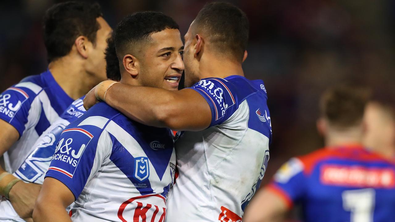 Bulldogs players celebrate a try.