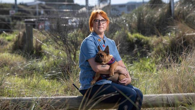 Breast cancer survivor Kate Thomas with her French Bulldog Bronco at Torquay. Picture: Brad Fleet