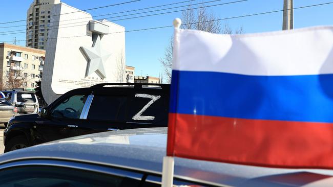 A column of vehicles with Russian flags parades through the streets of Volgograd. Picture: Dmitry Rogulin/TASS/Sipa USA/AAP