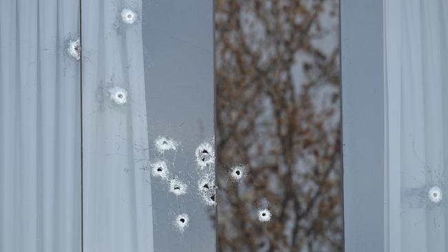 More than 10 bullet went through the house’s front window. Picture: David Crosling