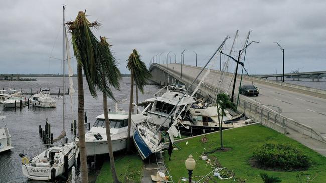 Boats are pushed up on a causeway after Hurricane Ian passed through Fort Myers, Florida. Picture: AFP