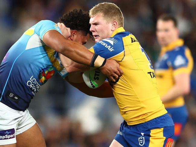 GOLD COAST, AUSTRALIA - JULY 13:  Charlie Guymer of the Eels is tackled during the round 19 NRL match between Gold Coast Titans and Parramatta Eels at Cbus Super Stadium, on July 13, 2024, in Gold Coast, Australia. (Photo by Chris Hyde/Getty Images)