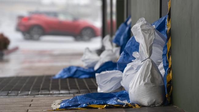 Businesses in Russell St sandbag in preparation for rising creek levels as the aftermath of TC Alfred impacts Toowoomba, Sunday, March 9, 2025. Picture: Kevin Farmer