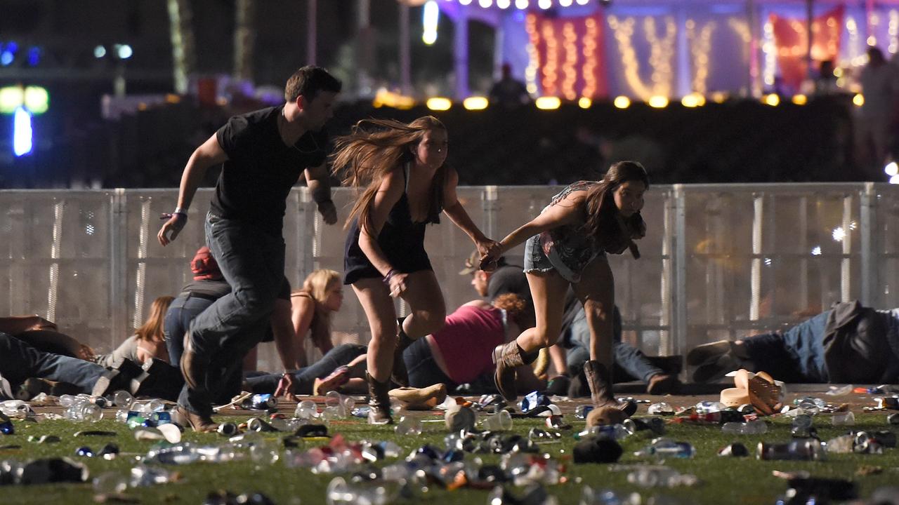 People running and to take cover at the Route 91 Harvest Festival. Picture: David Becker