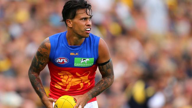 PERTH, WESTERN AUSTRALIA - MARCH 27: Allen Christensen of the Lions looks to pass the ball during the AFL round one match between the West Coast Eagles and the Brisbane Lions at Domain Stadium on March 27, 2016 in Perth, Australia. (Photo by Paul Kane/Getty Images)