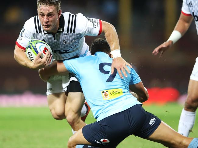 SYDNEY, AUSTRALIA - MARCH 23: Brett Cameron of the Crusaders is tackled during the round six Super Rugby match between the Waratahs and the Crusaders on March 23, 2019 in Sydney, Australia. (Photo by Mark Kolbe/Getty Images)