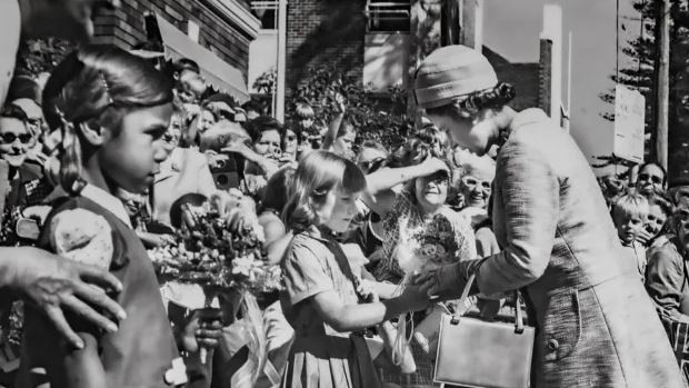 Queen Elizabeth visiting the Royal Far West children's home at Manly in May 1970. She received a bouquet of flowers from Christine Healey, from Balladoran.