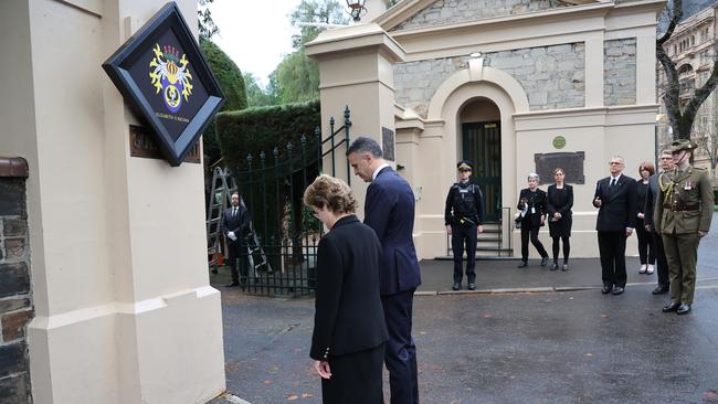 Her Excellency the Honourable Frances Adamson AC and Premier Peter Malinauskas during the ceremony of the hanging of the hatchment, on the front gates of Government House. NCA NewsWire / David Mariuz