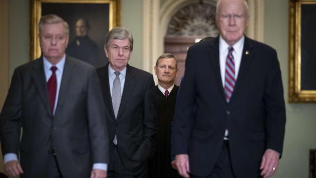 (L-R) Sen. Lindsey Graham, Sen. Roy Blunt, Supreme Court Chief Justice John Roberts and Sen. Pat Leahy arrive at the Senate chamber for impeachment proceedings. Picture: Getty Images.