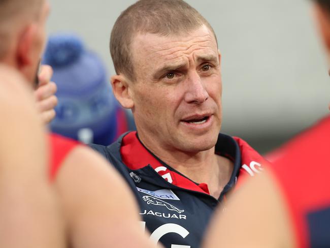 MELBOURNE, AUSTRALIA - JULY 05: Melbourne Demons Head Coach Simon Goodwin talks to his players during the round 5 AFL match between the Melbourne Demons and the Richmond Tigers at Melbourne Cricket Ground on July 05, 2020 in Melbourne, Australia. (Photo by Graham Denholm/AFL Photos via Getty Images)