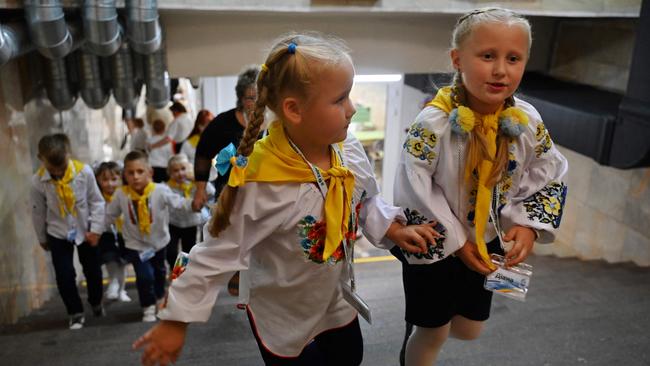 Year One students leave after lessons in a classroom set up in a subway station in Kharkiv, Ukraine. The city's schools have been closed due to a constant threat of Russian shelling. Picture: Sergey Bobok/AFP