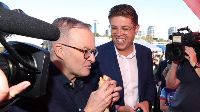 Labor leader Anthony Albanese eats a rhubarb donut during his visit to Ryde Wharf Market, seat of Bennelong. Accompanied by Labor’s candidate Jerome Laxale. Picture: Liam Kidston