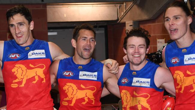 Once a Hawk, now a Lion. Hodge (centre, left) sings the team song with Oscar McInerney, Lachie Neale and Eric Hipwood after extending his perfect record with Brisbane over Hawthorn in Round 19.