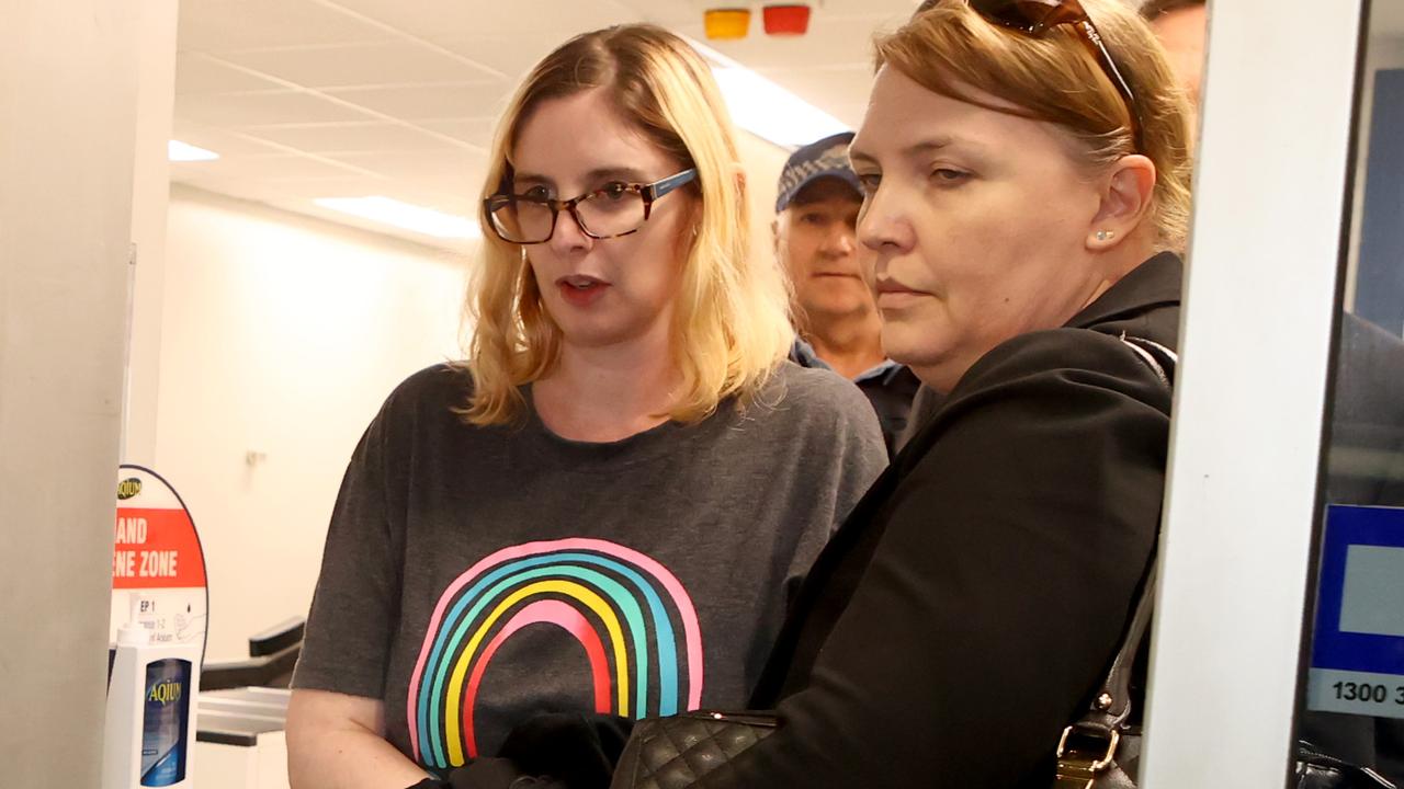 Lisa Lines escorted by police after being extradited back to Australia on charges of attempted murder of her husband. Picture: NCA NewsWire / Kelly Barnes