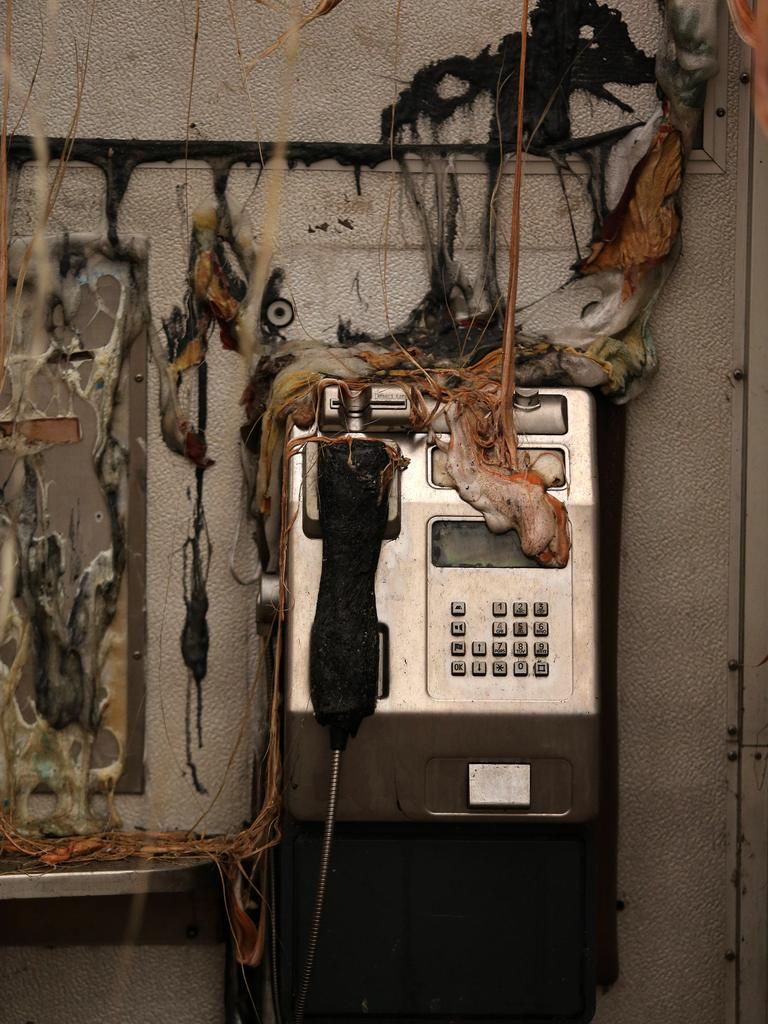 The morning after a devastating blaze destroyed homes and businesses in the small town of Cobargo. The town has been decimated by fire. An unburnt Telstra phone box in the Main Street of Cobargo.Picture Gary Ramage