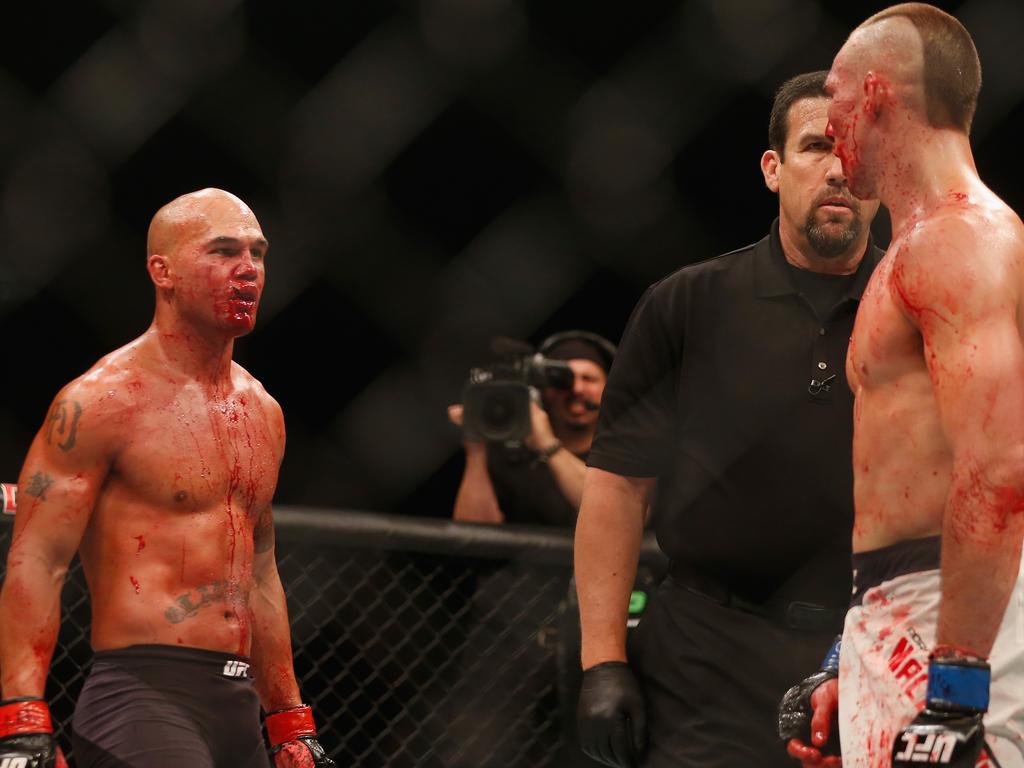 Robbie Lawler (L) and Rory MacDonald eye each other off after the fourth round. Picture: Getty Images