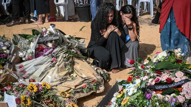 Relatives and friends of David Carroll who was killed by Palestinian Hamas militants in Kibbutz Be'eri mourn during his funeral in Revivim. Picture: AFP