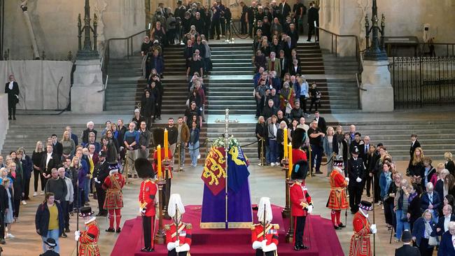 More than 250,000 people queued to walk past the coffin of Queen Elizabeth II, draped in the Royal Standard with the Imperial State Crown and the Sovereign's orb and sceptre. Picture: AFP