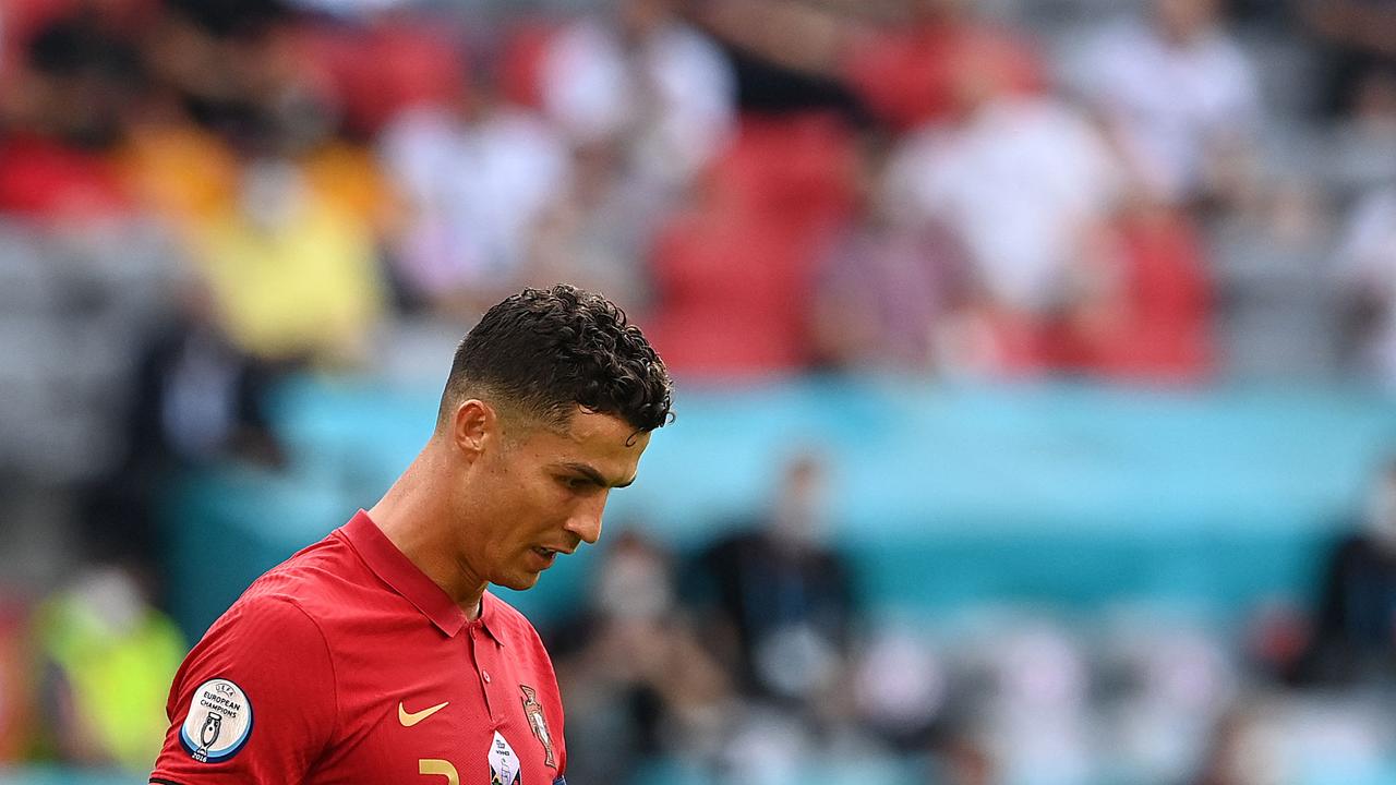 TOPSHOT - Portugal's forward Cristiano Ronaldo reacts after the UEFA EURO 2020 Group F football match between Portugal and Germany at Allianz Arena in Munich, Germany, on June 19, 2021. (Photo by CHRISTOF STACHE / POOL / AFP)