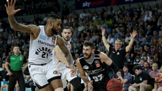 Jarrad Weeks of the Breakers is challenged by Shawn Long of United during an NBL match last year. (AAP Image/David Rowland)