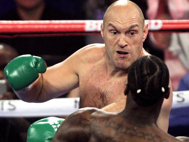 (FILES) In this file photo taken on February 23, 2020 British boxer Tyson Fury (L) and US boxer Deontay Wilder exchange punches during their World Boxing Council (WBC) Heavyweight Championship Title boxing match at the MGM Grand Garden Arena in Las Vegas. - The third fight in Tyson Fury and Deontay Wilder's heavyweight rivalry has been postponed as the coronavirus pandemic grips the United States and Britain, ESPN reported on March 24, 2020. (Photo by John Gurzinski / AFP)