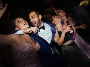 Groom dancing with friends and enjoying a wedding party