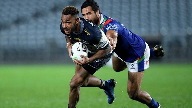 Hamiso Tabuai-Fidow of the Cowboys is tackled by Peta Hiku of the Warriors during the Round 5 NRL match between the New Zealand Warriors and the North Queensland Cowboys. (AAP Image/Dan Himbrechts)