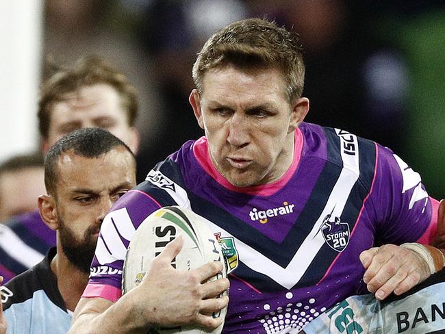 Ryan Hoffman of the Storm (centre) is tackled by Jesse Ramien of the Sharks (right) during the Round 22 NRL match between the Melbourne Storm and the Cronulla-Sutherland Sharks at AAMI Park in Melbourne, Sunday, August 12, 2018. (AAP Image/Daniel Pockett) NO ARCHIVING, EDITORIAL USE ONLY