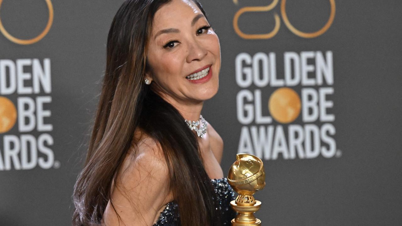 Malaysian actress Michelle Yeoh poses with the award for the Golden Globe Best Actress – Motion Picture – Musical/Comedy for Everything Everywhere All at Once. She is nominated for the best actress Oscar. (Photo by Frederic J. Brown / AFP)